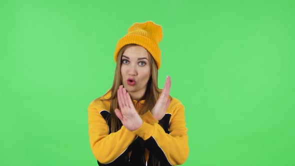 Portrait Girl in Yellow Hat Strictly Gesturing with Hands Crossed Making X Shape Meaning Denial alt