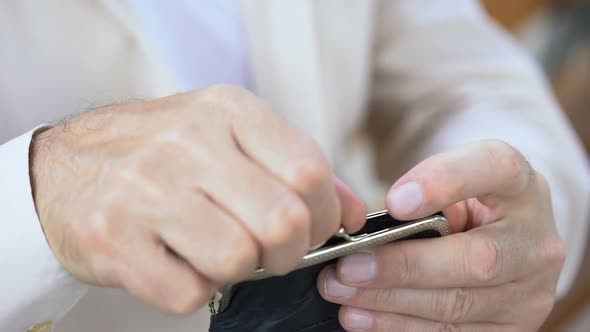 Pensioner Hand Putting Euro Banknotes in Wallet, Budget and Money Saving alt