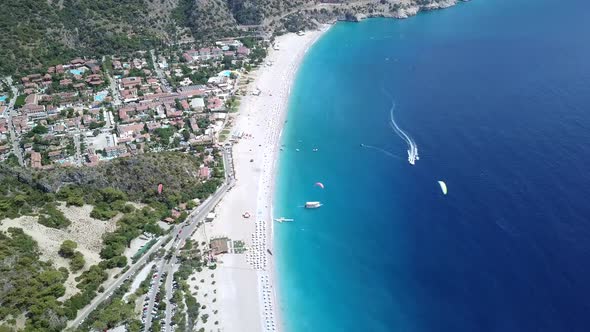 Paragliders Flying Over Sea and Beach on Resort