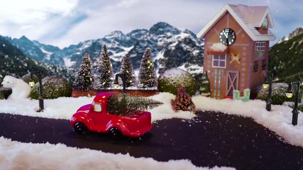 Christmas winter scenery with pickup truck driving with Christmas tree on car trunk. Stop motion