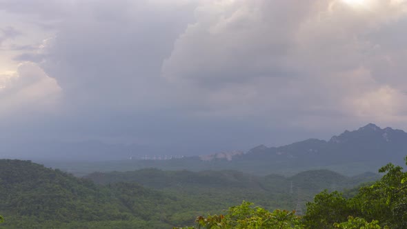 Rain storms and black clouds moving over the mountains.