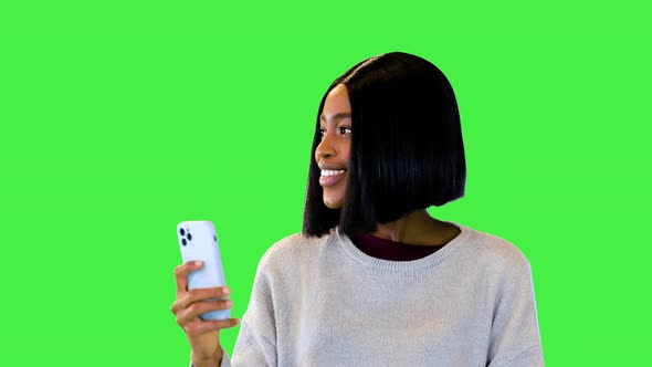 Excited Black Student Girl Walk Use Smart Phone for Making Photos on Mobile Camera with Happy Smile