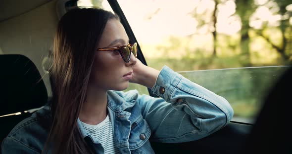 Woman Looking in Car Window