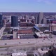 Wide aerial pan of trafficked highway, river and Grand Rapids skyline - VideoHive Item for Sale