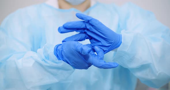 Doctor Pulls Off Protective Gloves Coronavirus - Covid-19 Concept alt