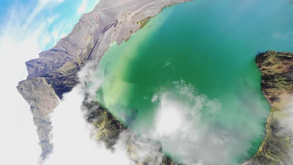 Aerial video of low laying clouds over Mount Rinjani in Indonesia (2) alt