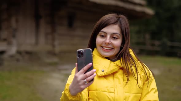 The Girl Communicates By Video on the Phone alt
