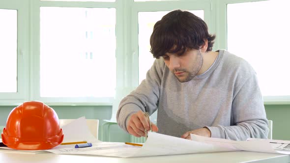 Architect Uses Compass at His Work alt