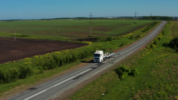 Aerial View of a Truck on the Highway alt