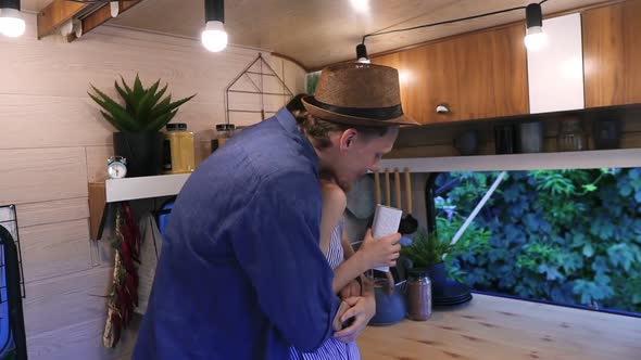 Positive Young Couple Living or Travelling in Van alt