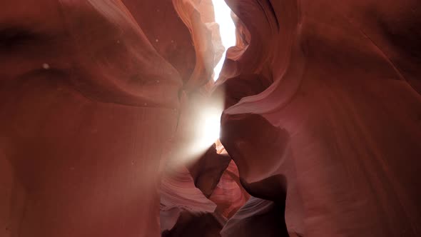 Antelope Canyon With Wavy And Smooth Stone Walls Of Red Color And Sun Ray Shines alt