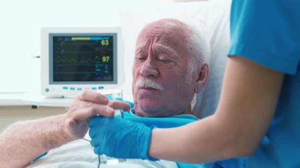 Old patient taking pills with water