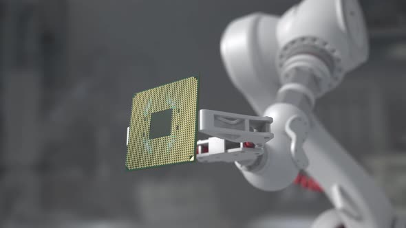 A Robot Arm Holding A Modern Supercomputer Processor.