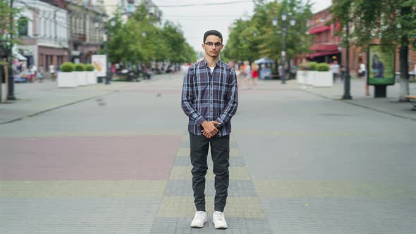 Time Lapse Portrait of Handsome Arab Man in Casual Clothing Outdoors in City Street Standing Alone alt