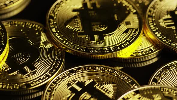 Rotating shot of Bitcoins  alt