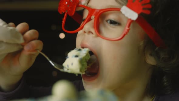 The Girl is Eating Cake with Green Dough Sour Cherries and Sour Cream alt