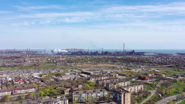 Industrial plant by the sea. alt