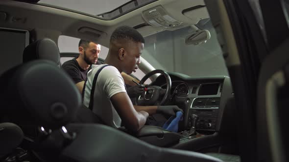 Young African American and European Work at Work Dry Cleaning Car Interior Work alt