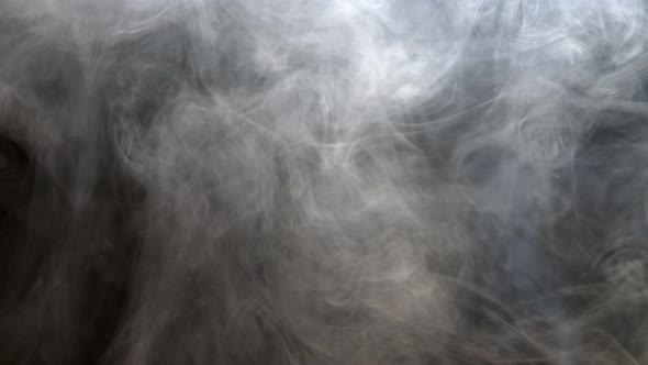Smoke moving against black