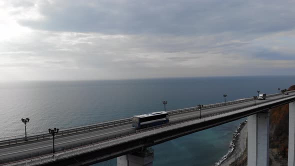 Aerial View of the Highway Viaduct on Concrete Pillars in the Mountains, Drone Flight Over the alt