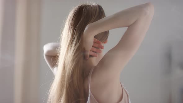 Slowmo of Beautiful Young Girl Waking Up and Smiling for Camera alt