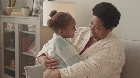 Grandmother Hugging Little Girl alt