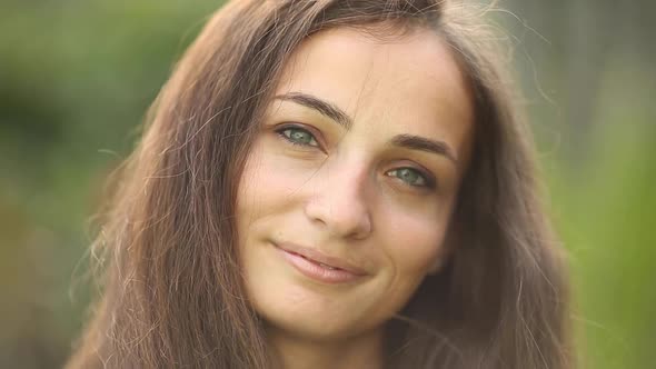 Portrait of Cheerful Woman Smiles and Enjoys of the Moment Isolated on Blur Background