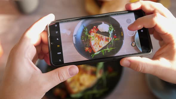 Male Hands Take Photos of Food of French Quiche By Modern Smartphone