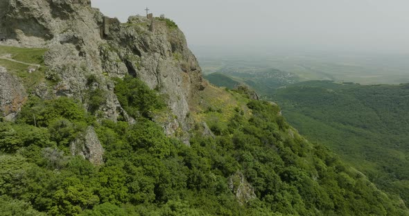 Drone shot of two Christian crosses located in the ruins of Azeula Fortress. alt