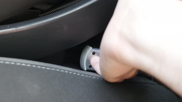 Disconnecting booster seat  from car brackets 4k footage alt