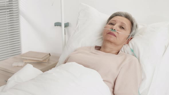 Elderly Female Patient with Oxygen Tube in Nose, Stock Footage | VideoHive