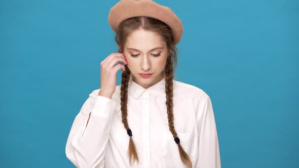 Portrait Closeup of Gorgeous Female Artist Wearing French Beret and Two Braids Hairstyle alt