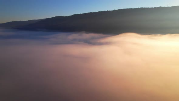 4K Aerial view of Mountains landscape with morning fog. alt