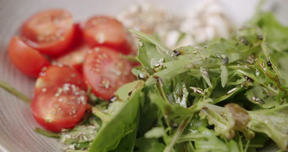 Tasty Salad in a White Plate on a White Background alt