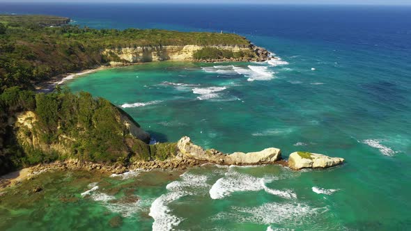 Aerial drone view of crashing waves in Nagua's coastline. Dominican Republic alt