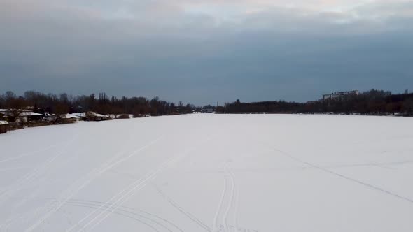 Cross-country wild ski track lines on snowy river