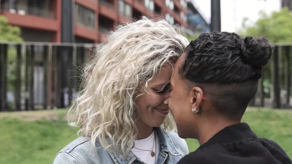 Happy Mixed Race Lesbian Couple In Love Kissing And Cuddling Girlfriends M By Williamperugini