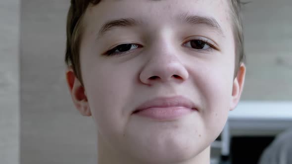 A Smiling Child Shakes Head and Says No Then Agrees Waving Head and Says Yes alt