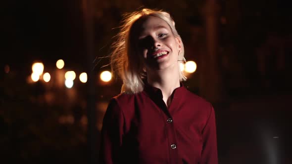 Portrait of Millennial Hipster Woman with Blond Hairstyle Makes Funny Faces, Fooling Around. City alt