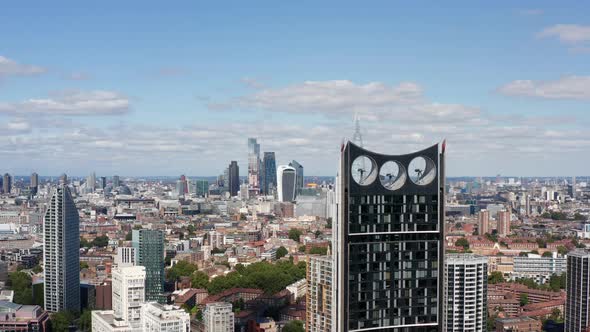 Forwards Fly Around Modern Skyscraper with Wind Turbines in Top Part of Construction alt