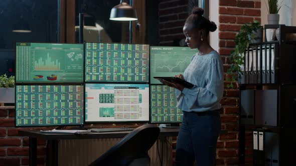 Hedge Fund Trader Following Stock Market Sales on Digital Tablet alt