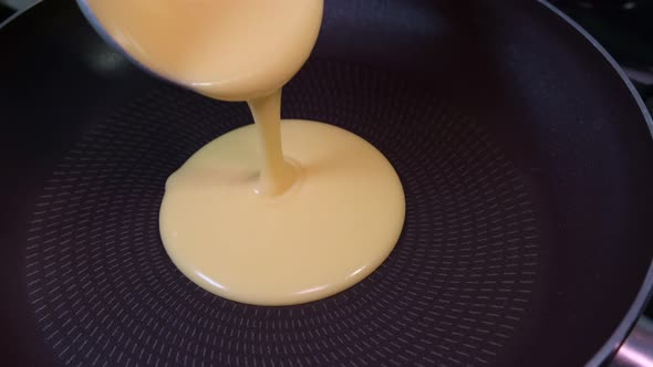 Slow Motion Pouring Pancake Mixture Frying Pan Closeup American Breakfast