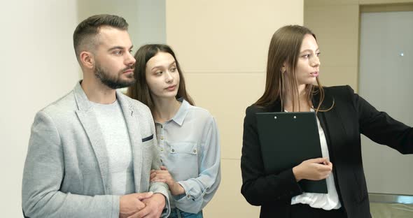 Broker Showing Couple New Flat