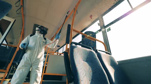 Coronavirus Prevention, Sanitary Disinfection Process. Inside View of a Bus Being Chemically alt