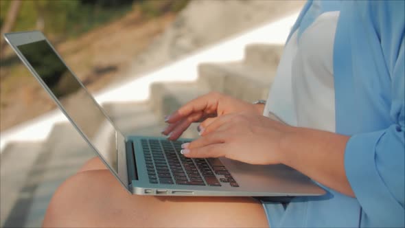 Business Lady Working on the Laptop, Attractive Brunette in a Blue Suit With a Laptop, Attractive alt