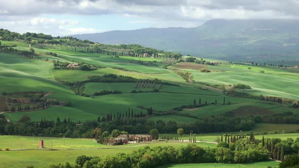 Shadows of Clouds Slide on Hills of Tuscany, Italy alt