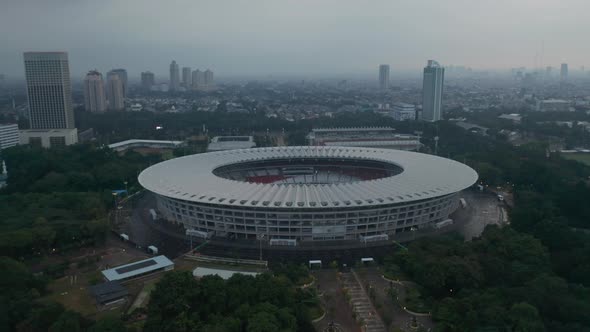 Close Up Tilting Aerial Shot of Gelora Bung Karno Athletic Stadium Facilities in Modern City Center alt