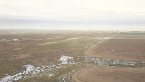 Arial view of the rural farmland in early Spring. alt