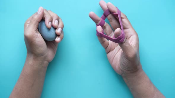 Hand and Finger Strengthening Exercises on Light Green Background alt