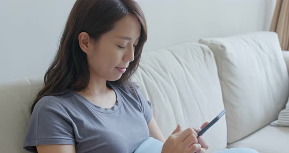 Woman use of smart phone at home alt